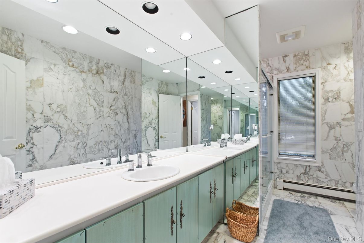 Bathroom, Dual Sink Vanities, Glass Shower, Interior, Marble, Marble Walls, Recessed Lighting