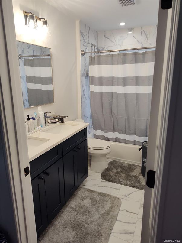 Bathroom, Dual Sink Vanities, Interior, Marble, Marble Walls, Recessed Lighting
