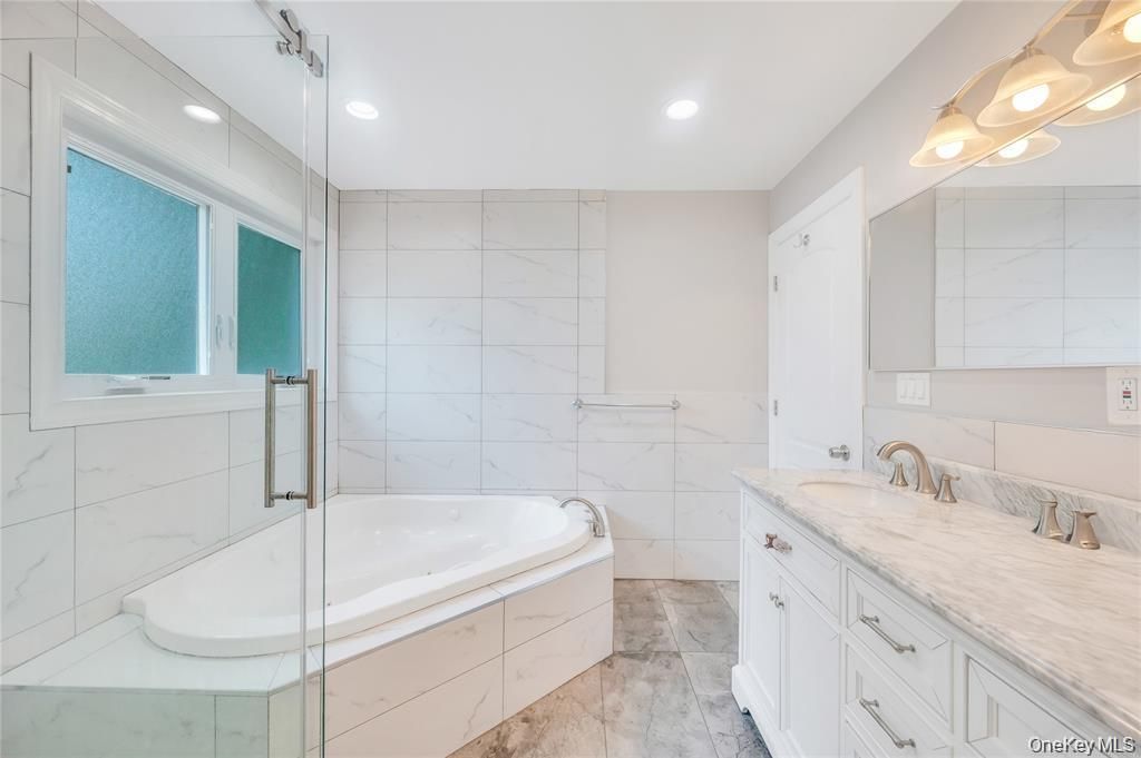 Bathroom, Dual Sink Vanities, Glass Shower, Interior, Marble Walls, Recessed Lighting