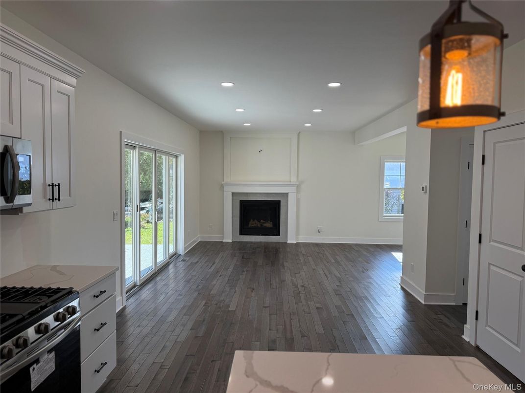 Empty room, Fireplace, Interior, Kitchen, Recessed Lighting, Wood Texture Flooring