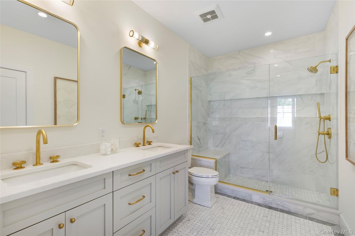 Bathroom, Dual Sink Vanities, Glass Shower, Interior, Marble Walls, Recessed Lighting