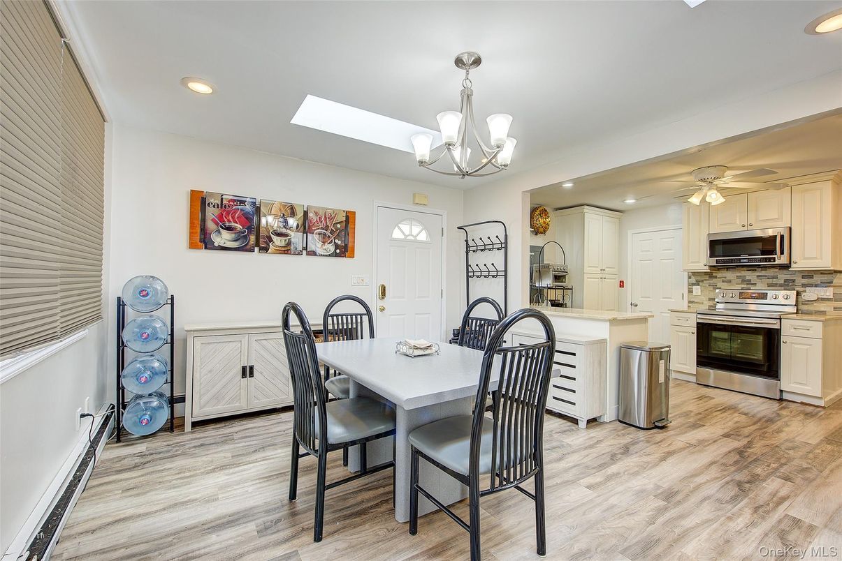 Chandelier, Dining room, Interior, Kitchen, Recessed Lighting, Stainless Steel Appliances, Wood Texture Flooring