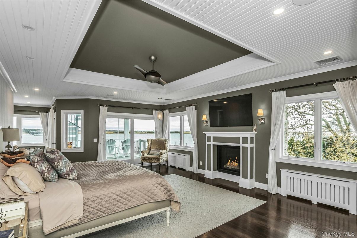 Bedroom, Fireplace, Interior, Recessed Lighting, Water, Wood Texture Flooring