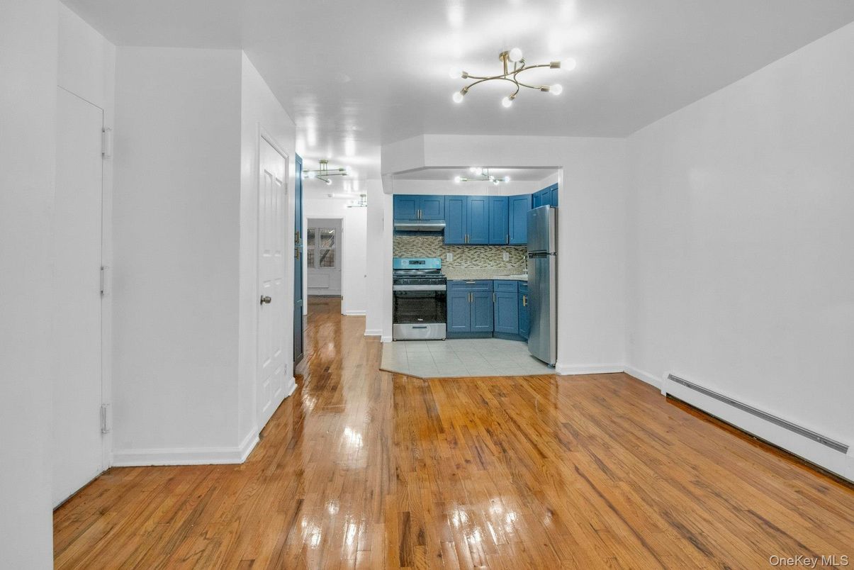 Empty room, Interior, Kitchen, Stainless Steel Appliances, Wood Texture Flooring