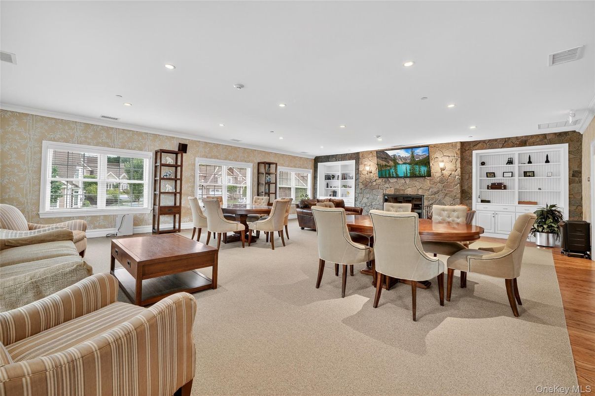Dining room, Fireplace, Interior, Recessed Lighting, Stone Walls, Wood Texture Flooring