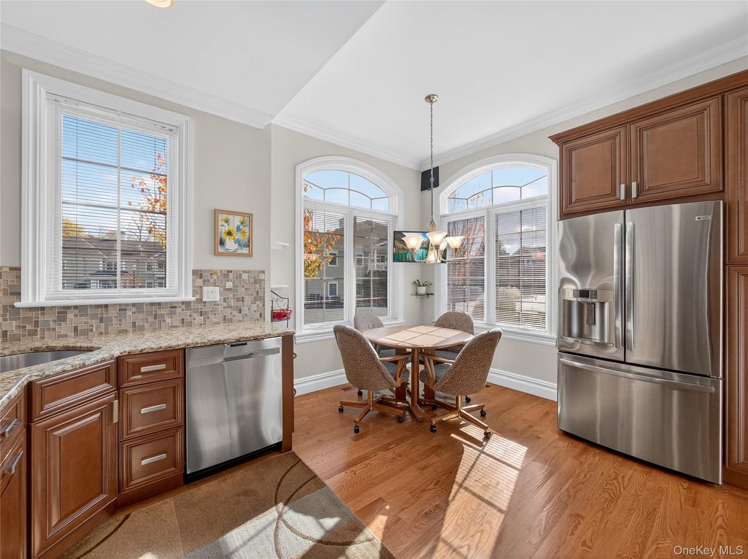 Chandelier, Dining room, Interior, Kitchen, Pendant Lights, Stainless Steel Appliances, Wood Texture Flooring