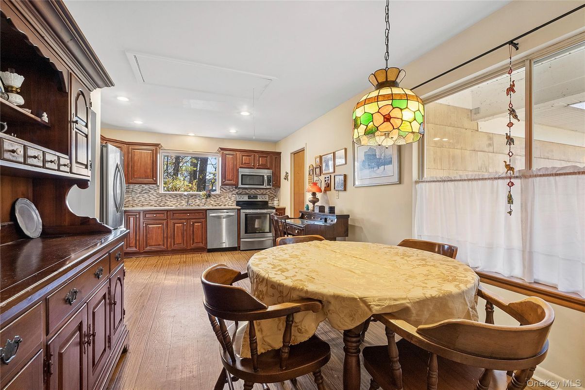 Dining room, Interior, Kitchen, Pendant Lights, Recessed Lighting, Stainless Steel Appliances, Wood Texture Flooring