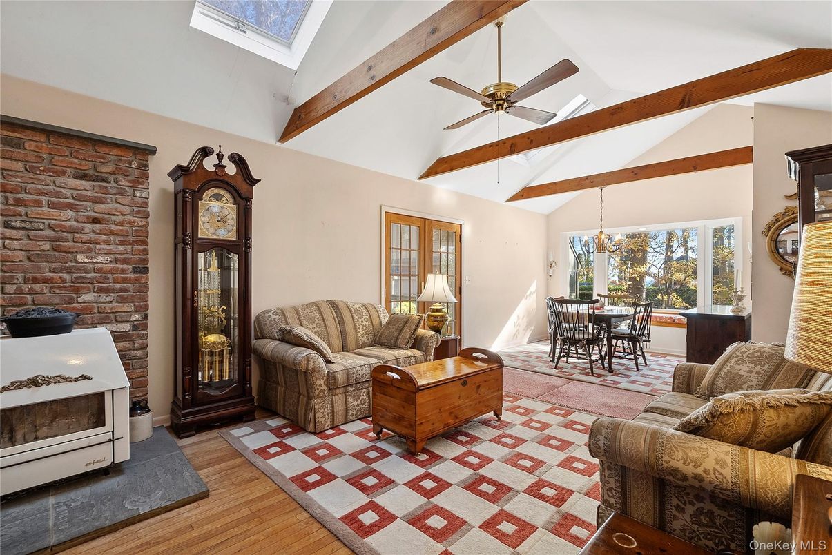 Dining room, Fireplace, Interior, Living room, Stone Walls, Wooden Beams, Wood Texture Flooring