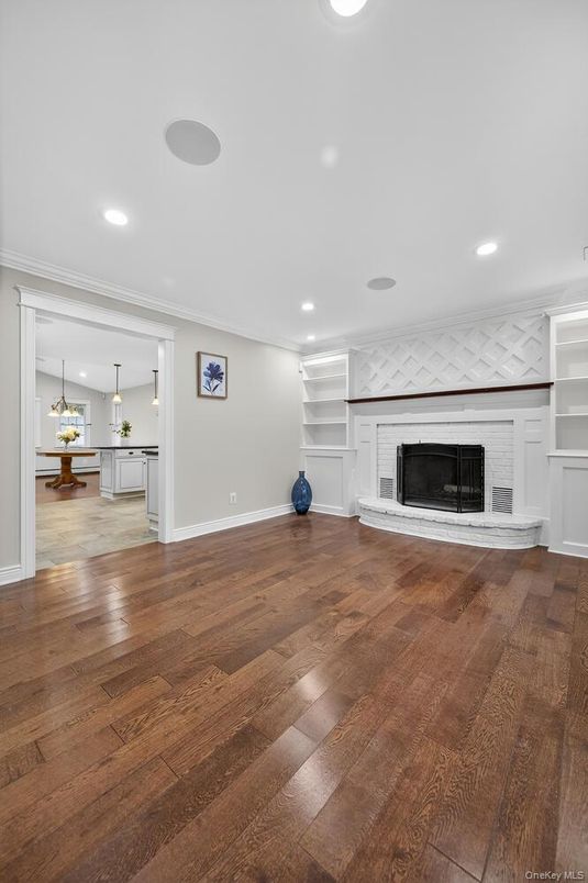 Empty room, Fireplace, Interior, Pendant Lights, Recessed Lighting, Wood Texture Flooring