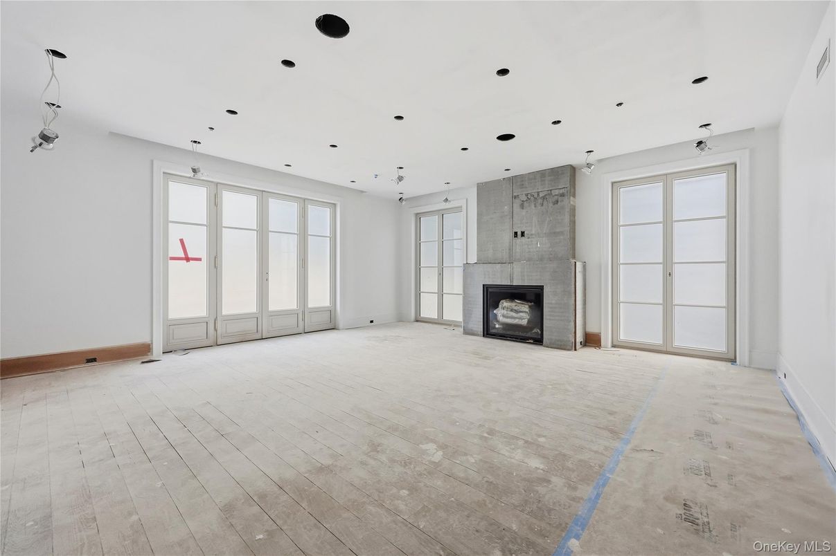 Empty room, Fireplace, Interior, Pendant Lights, Recessed Lighting, Wood Texture Flooring