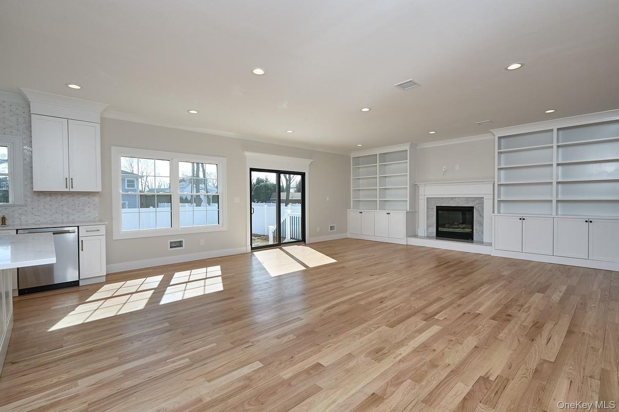 Empty room, Fireplace, Interior, Kitchen, Recessed Lighting, Wood Texture Flooring