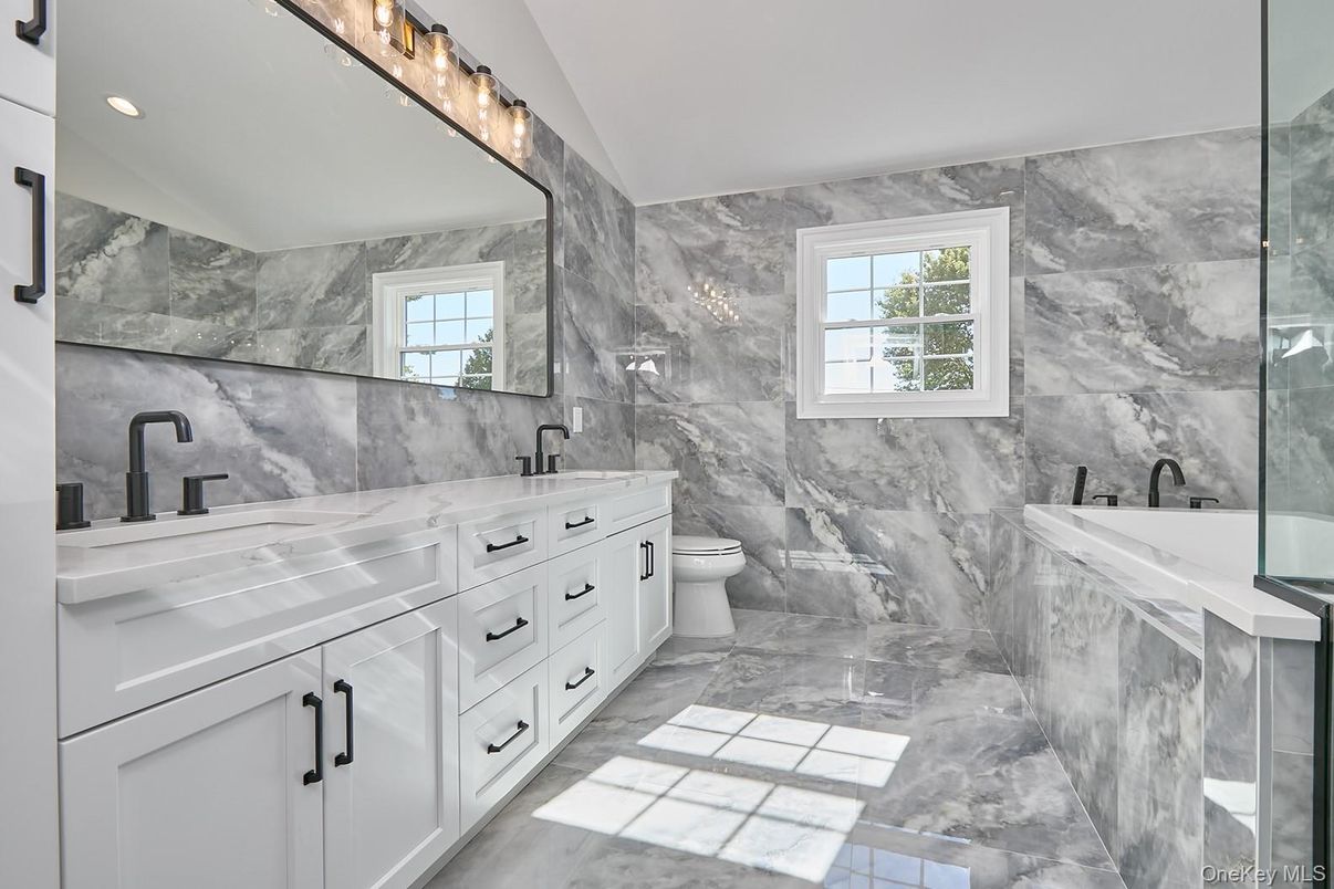 Bathroom, Dual Sink Vanities, Interior, Marble, Marble Walls, Recessed Lighting