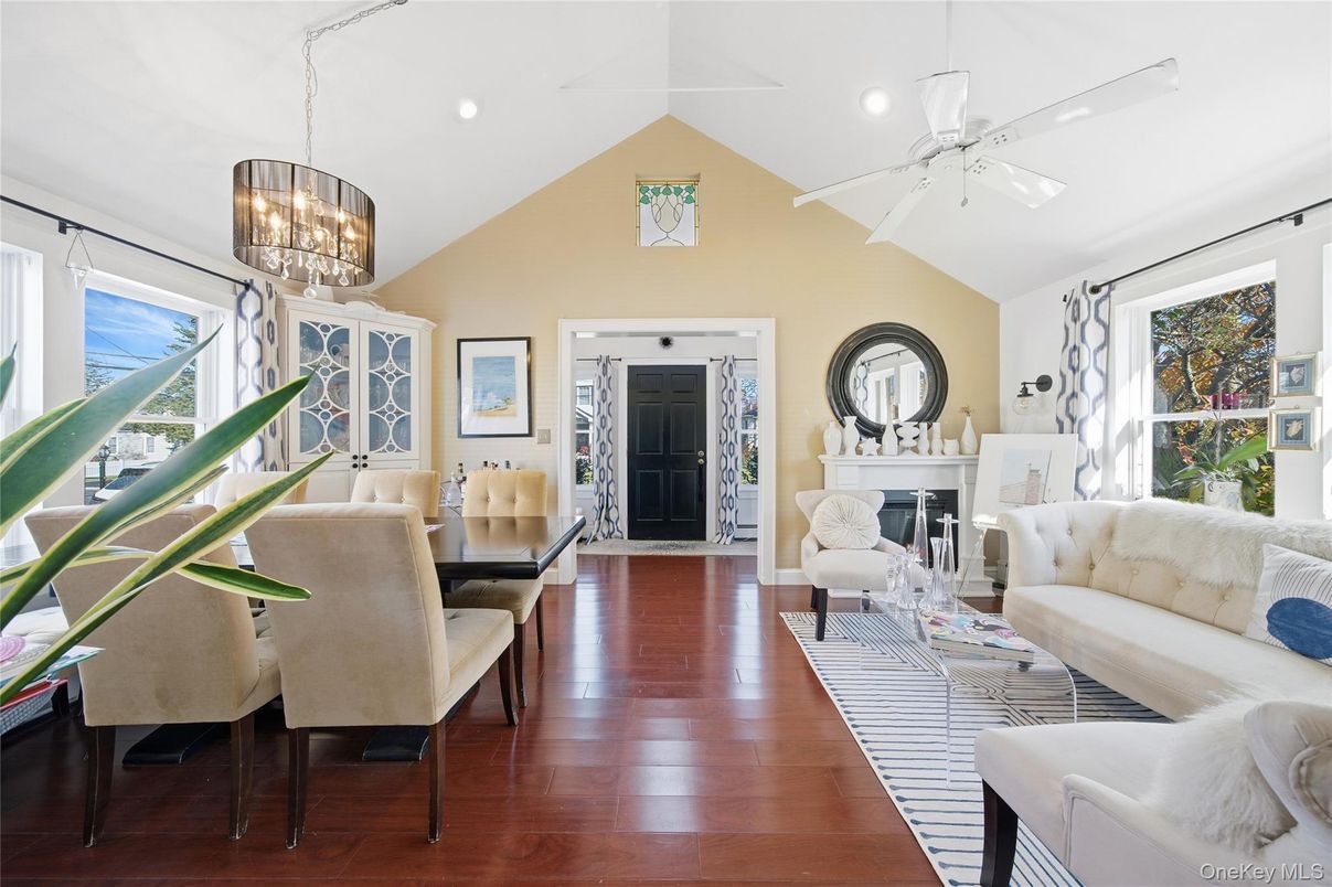 Chandelier, Dining room, Fireplace, Interior, Living room, Pendant Lights, Recessed Lighting, Wood Texture Flooring