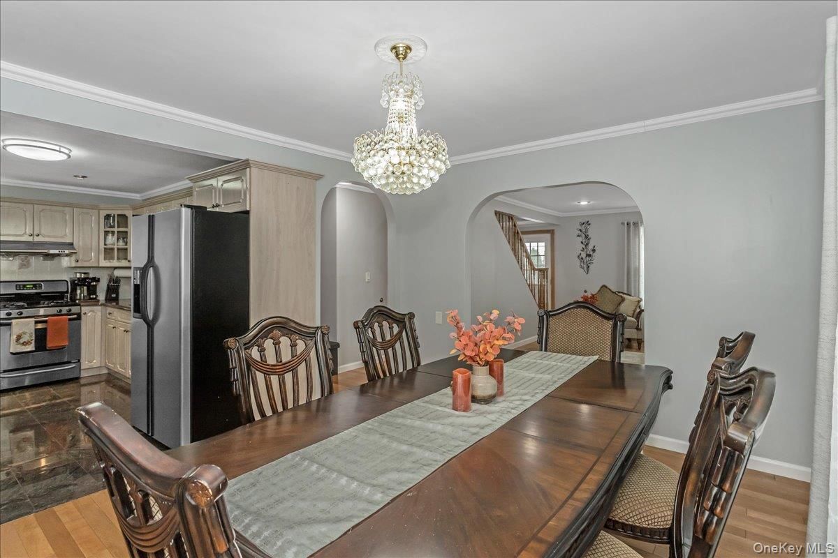 Chandelier, Dining room, Interior, Kitchen, Recessed Lighting, Stainless Steel Appliances, Wood Texture Flooring