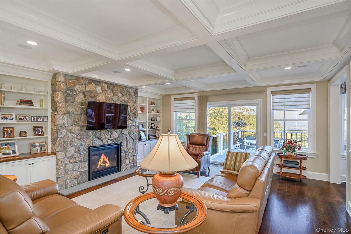 Fireplace, Interior, Living room, Recessed Lighting, Stone Walls, Wood Texture Flooring