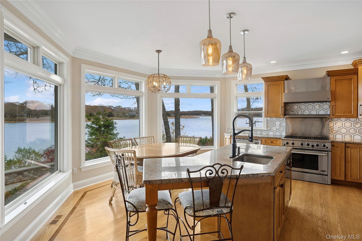 Dining room, Interior, Kitchen, Pendant Lights, Recessed Lighting, Stainless Steel Appliances, Water, Wood Texture Flooring