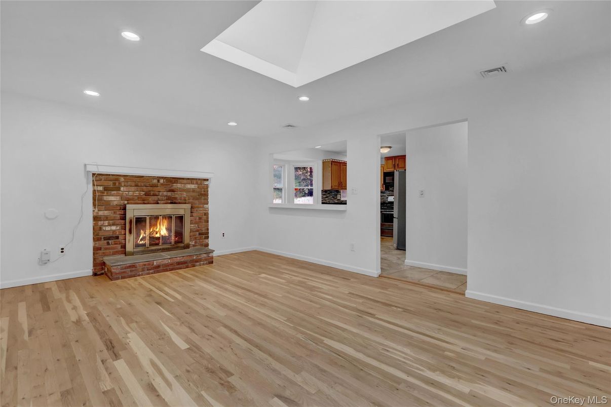 Empty room, Fireplace, Interior, Recessed Lighting, Wood Texture Flooring