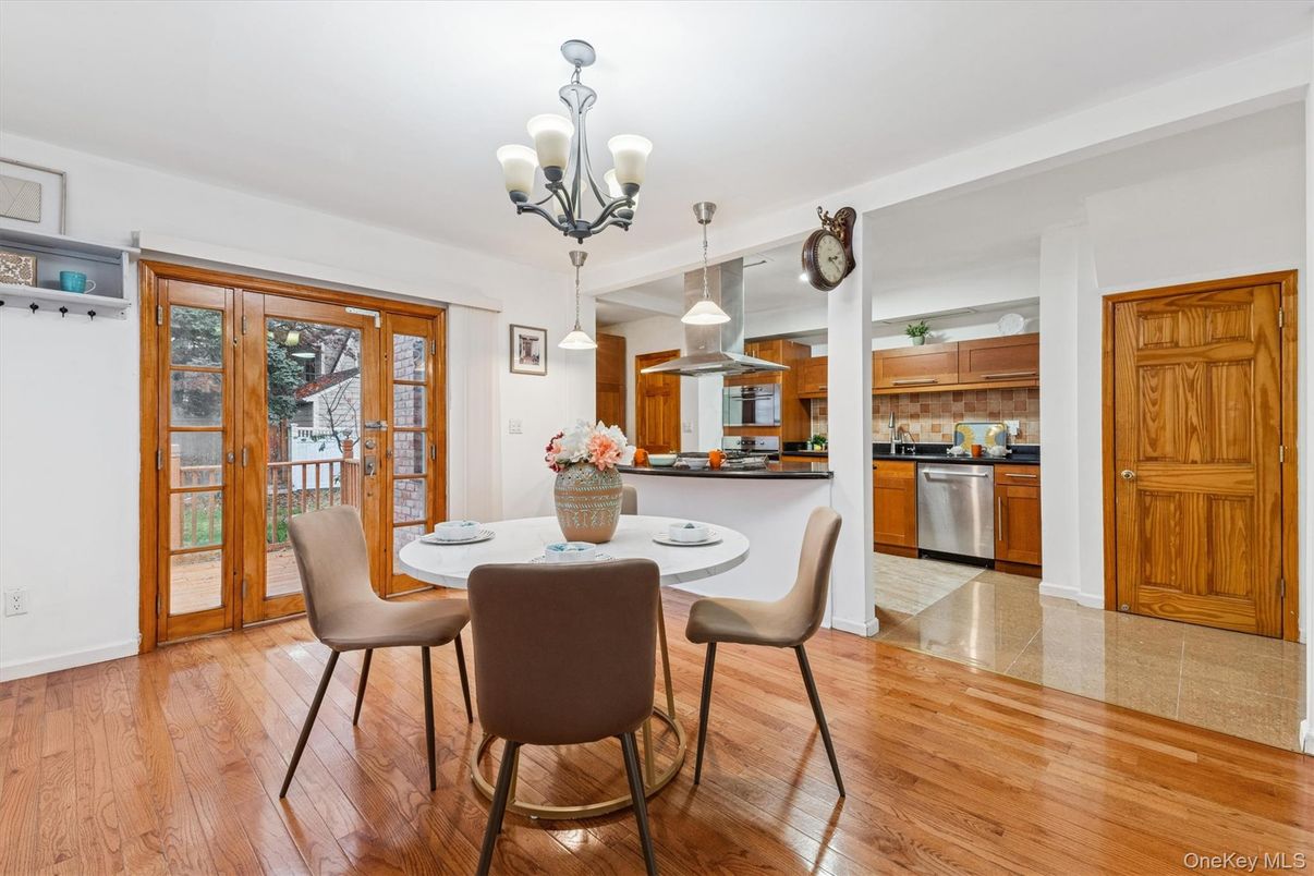 Chandelier, Dining room, Interior, Kitchen, Pendant Lights, Stainless Steel Appliances, Wood Texture Flooring