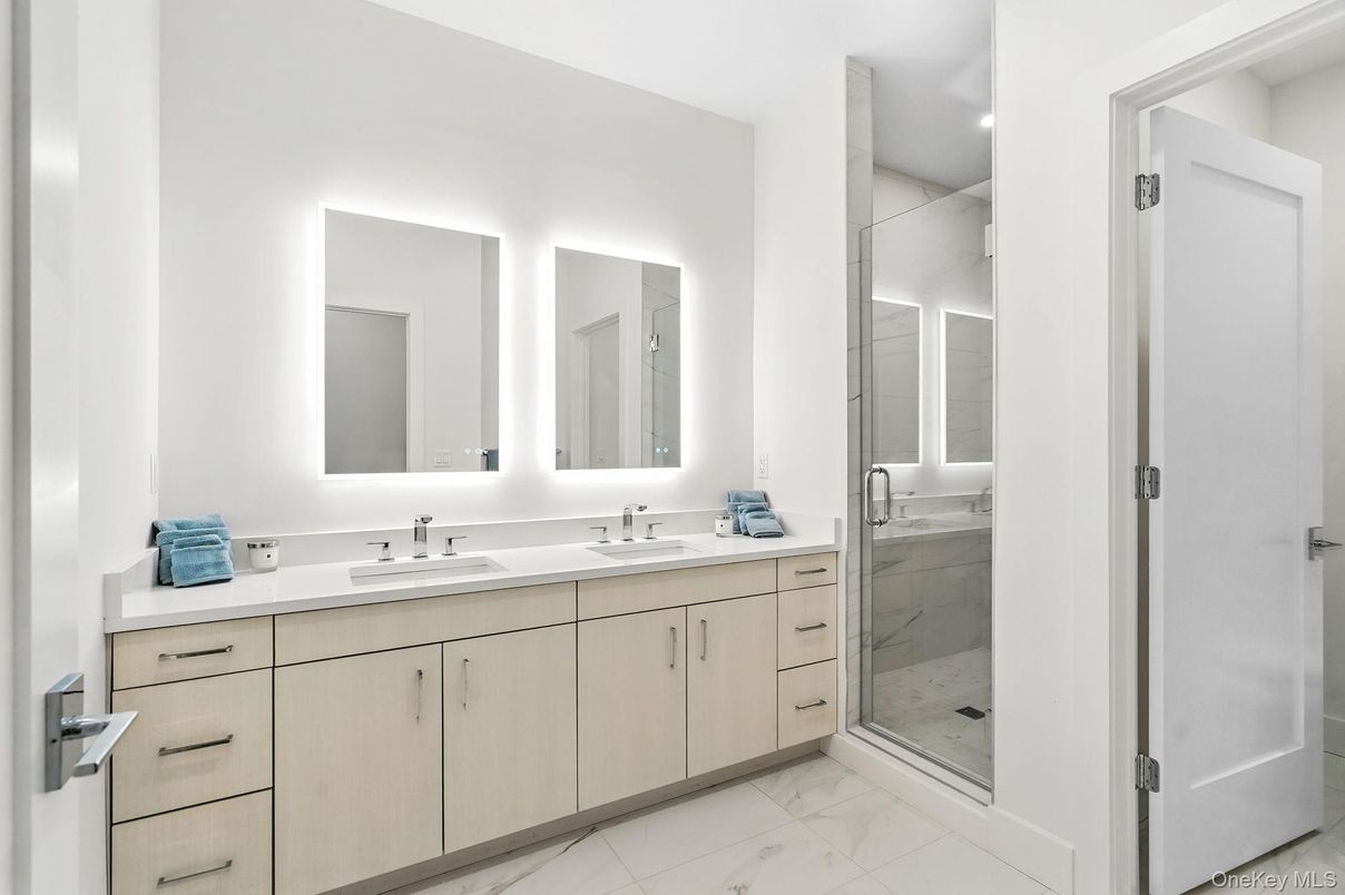 Bathroom, Dual Sink Vanities, Glass Shower, Interior, Marble, Marble Walls, Recessed Lighting