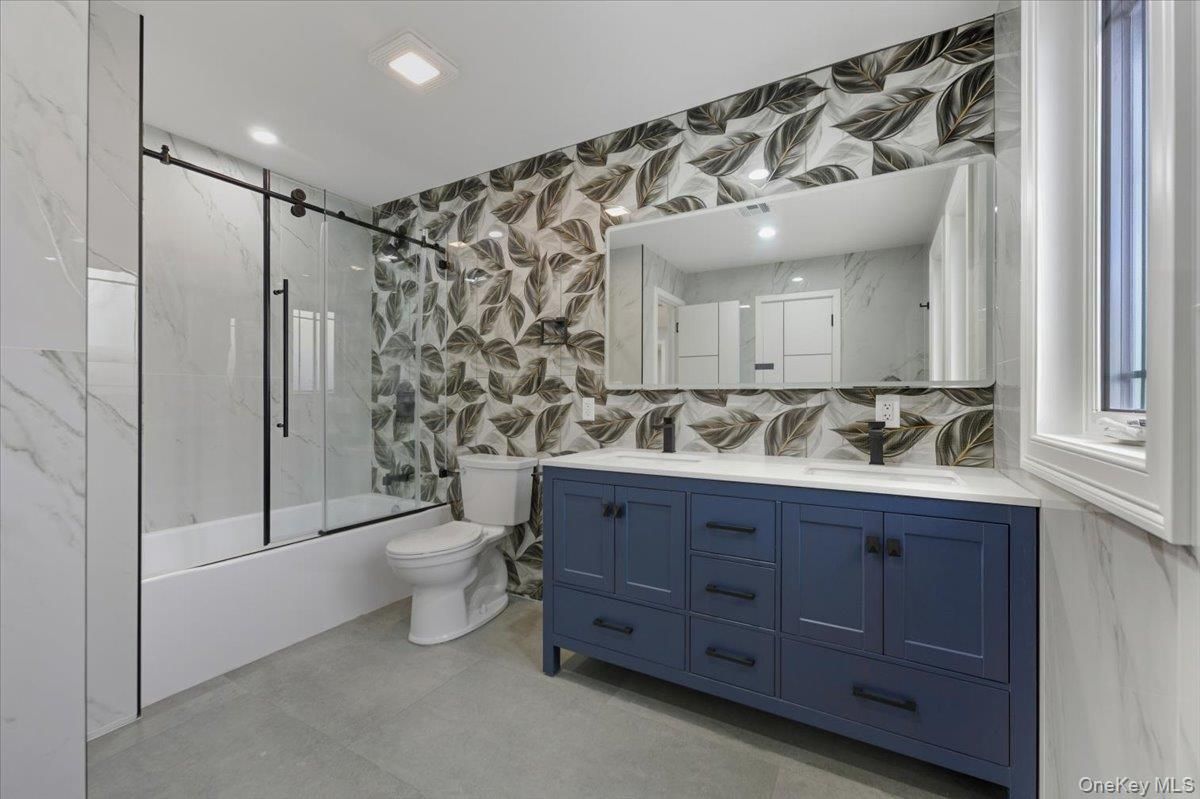 Bathroom, Dual Sink Vanities, Glass Shower, Interior, Marble Walls, Recessed Lighting