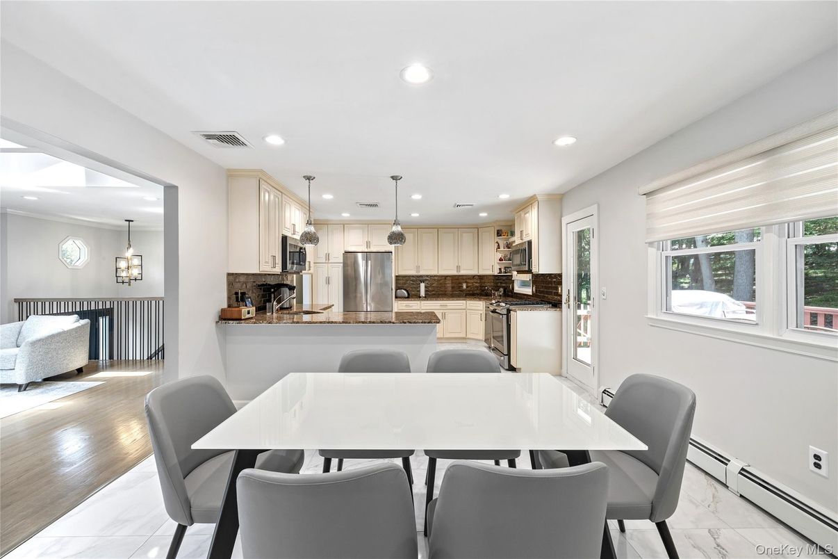 Dining room, Interior, Kitchen, Marble, Pendant Lights, Recessed Lighting, Stainless Steel Appliances, Wood Texture Flooring