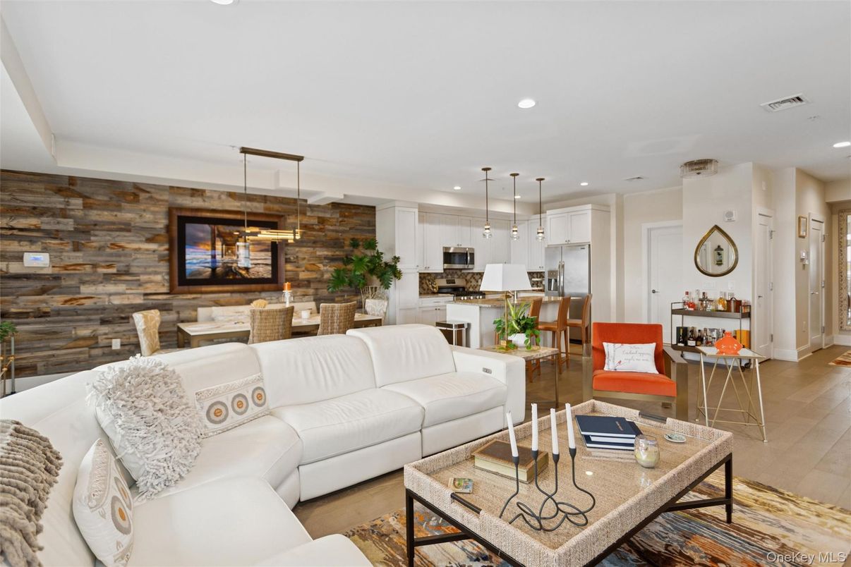 Dining room, Interior, Kitchen, Living room, Pendant Lights, Recessed Lighting, Stainless Steel Appliances, Stone Walls, Wood Texture Flooring, Wooden Walls