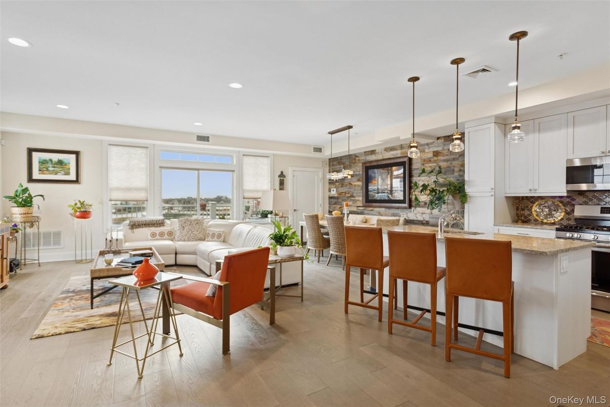 Dining room, Interior, Kitchen, Living room, Pendant Lights, Recessed Lighting, Stainless Steel Appliances, Stone Walls, Wood Texture Flooring