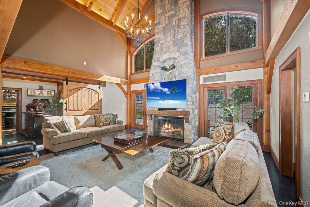 Chandelier, Fireplace, Interior, Living room, Stone Walls, Wooden Beams, Wooden Ceilings