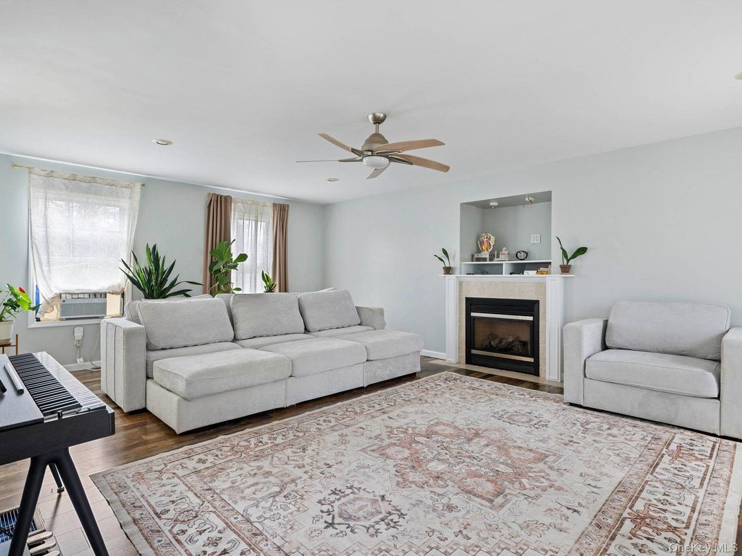 Fireplace, Interior, Piano, Recessed Lighting, Wood Texture Flooring