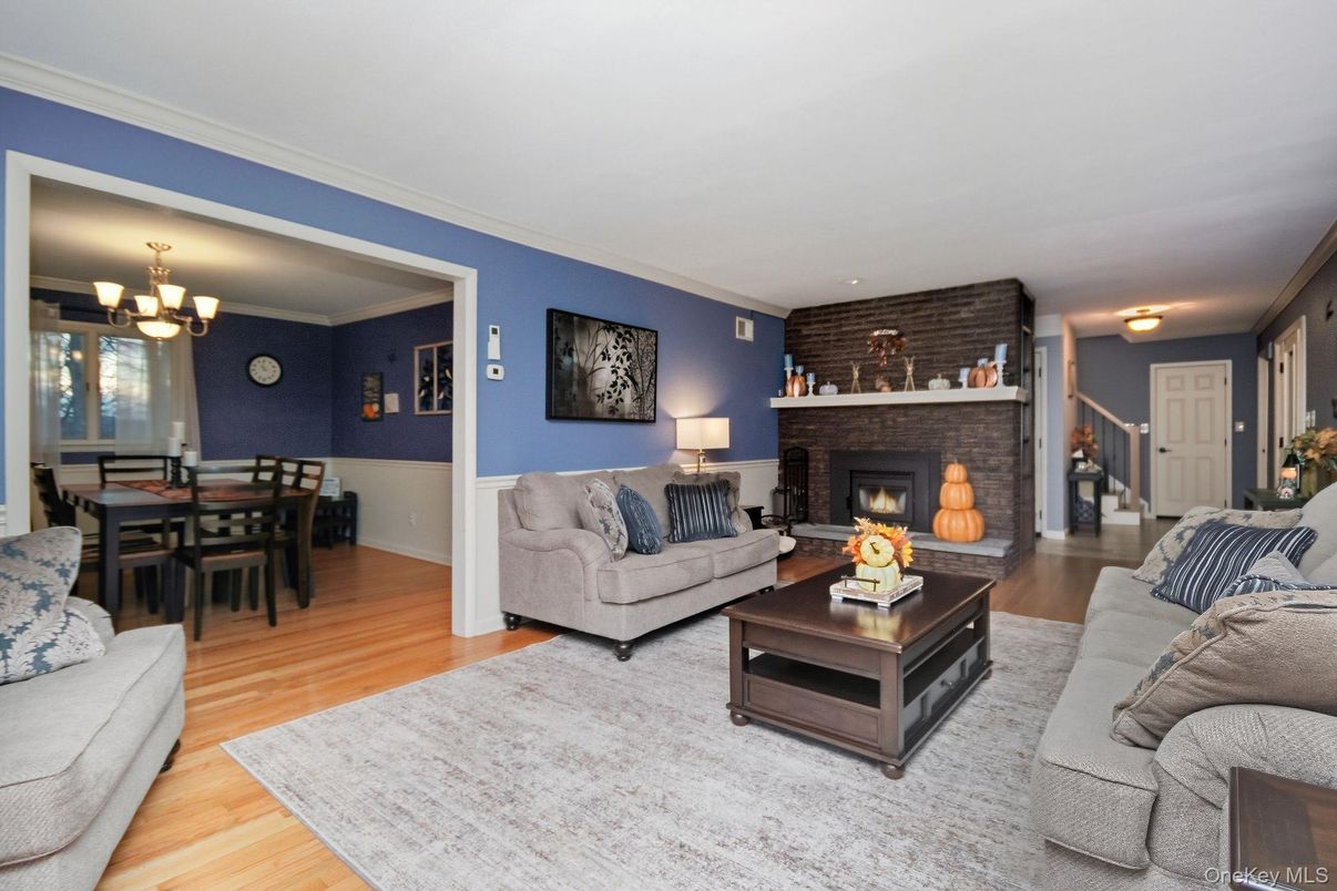 Chandelier, Dining room, Fireplace, Interior, Living room, Stone Walls, Wood Texture Flooring