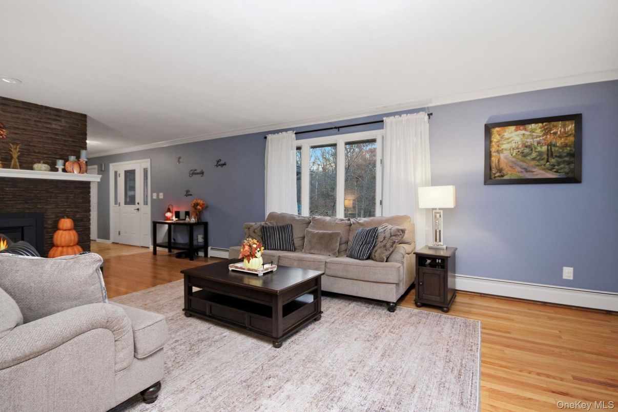 Fireplace, Interior, Living room, Recessed Lighting, Stone Walls, Wood Texture Flooring