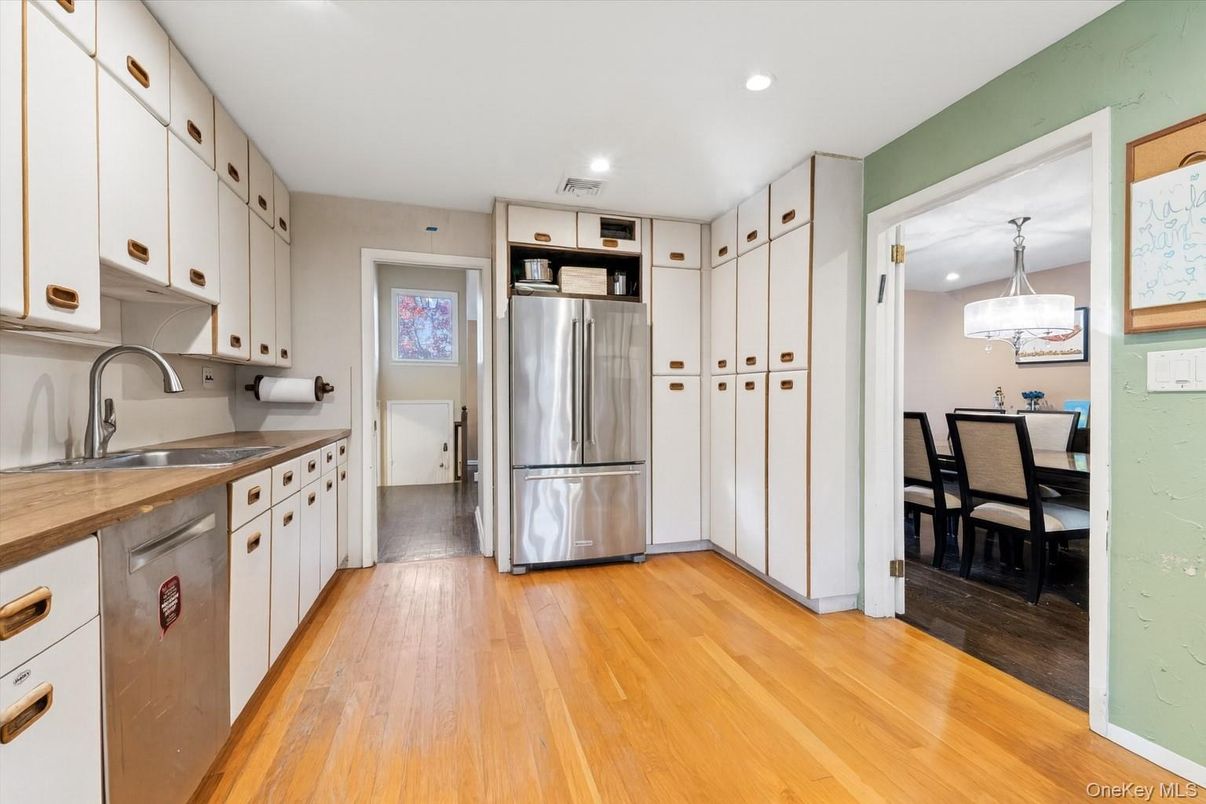 Dining room, Interior, Kitchen, Pendant Lights, Recessed Lighting, Stainless Steel Appliances, Wood Texture Flooring