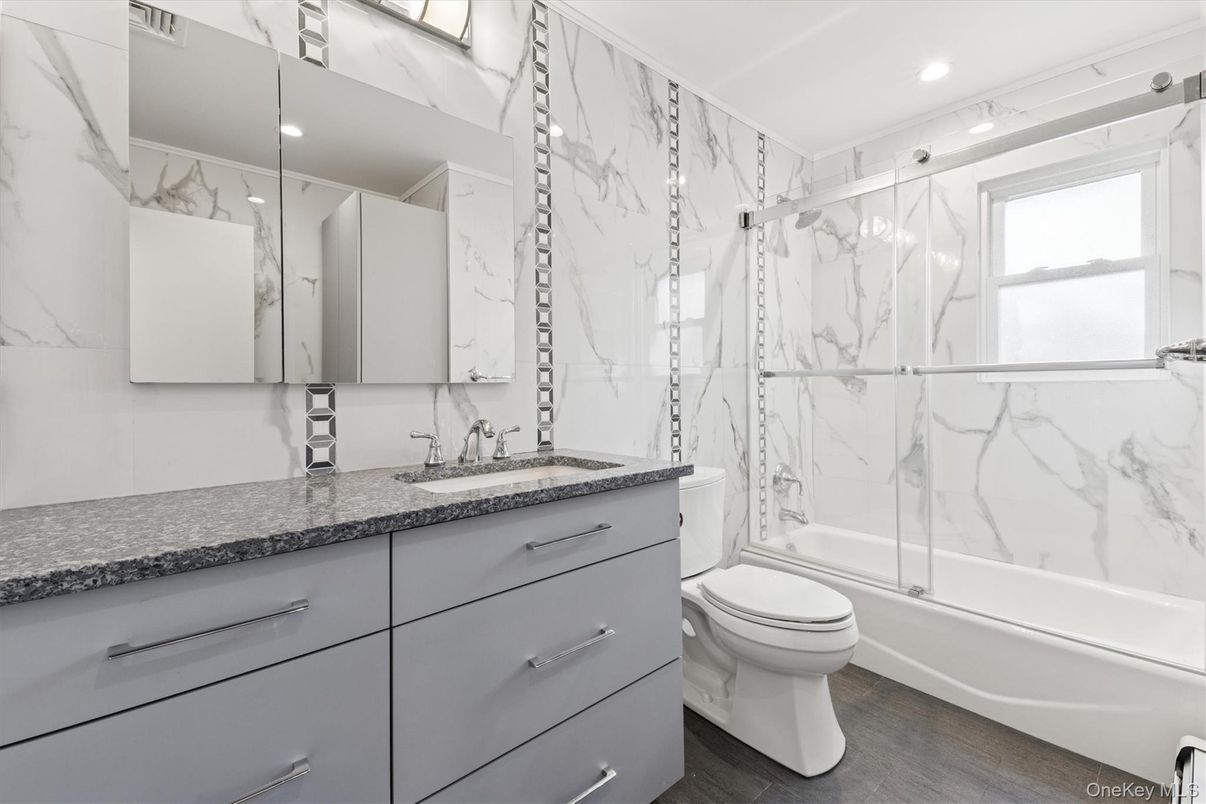 Bathroom, Glass Shower, Interior, Marble Walls, Recessed Lighting, Wood Texture Flooring