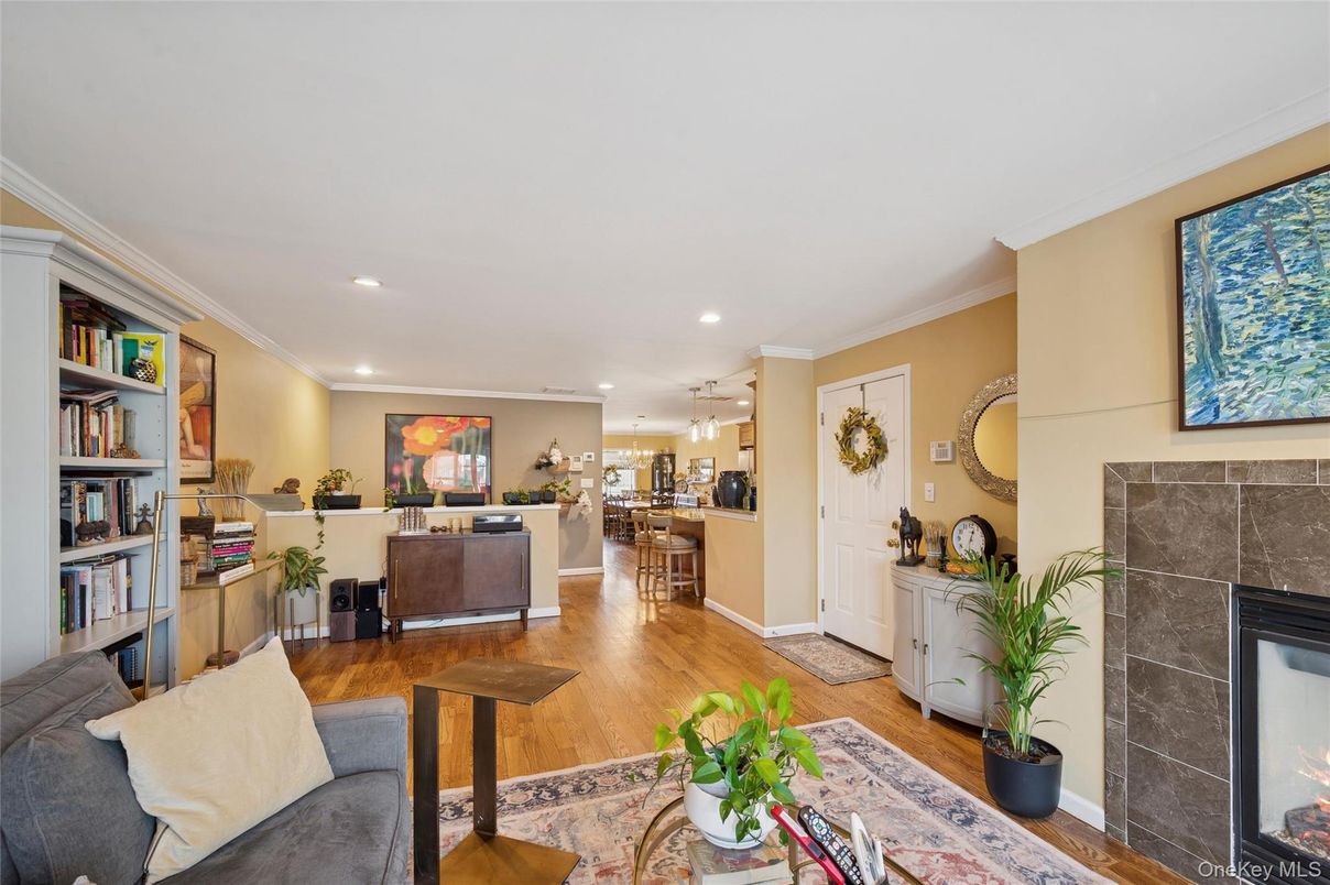 Dining room, Fireplace, Interior, Living room, Pendant Lights, Recessed Lighting, Wood Texture Flooring
