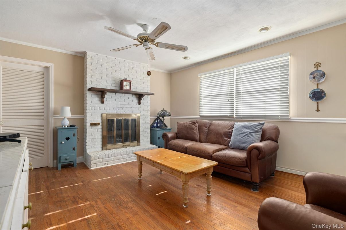 Fireplace, Interior, Living room, Recessed Lighting, Stone Walls, Wood Texture Flooring