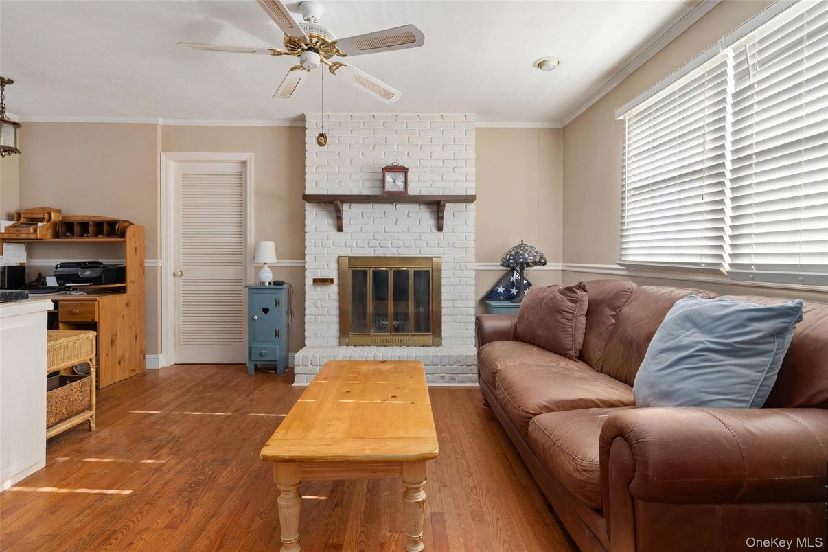 Fireplace, Interior, Living room, Recessed Lighting, Stone Walls, Wood Texture Flooring