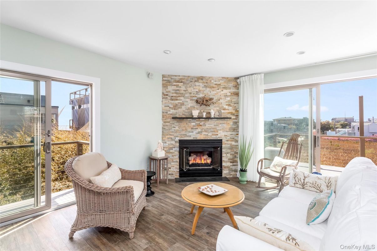 Fireplace, Interior, Living room, Recessed Lighting, Stone Walls, Wood Texture Flooring