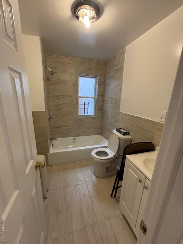 Bathroom, Dual Sink Vanities, Interior, Marble Walls, Wood Texture Flooring