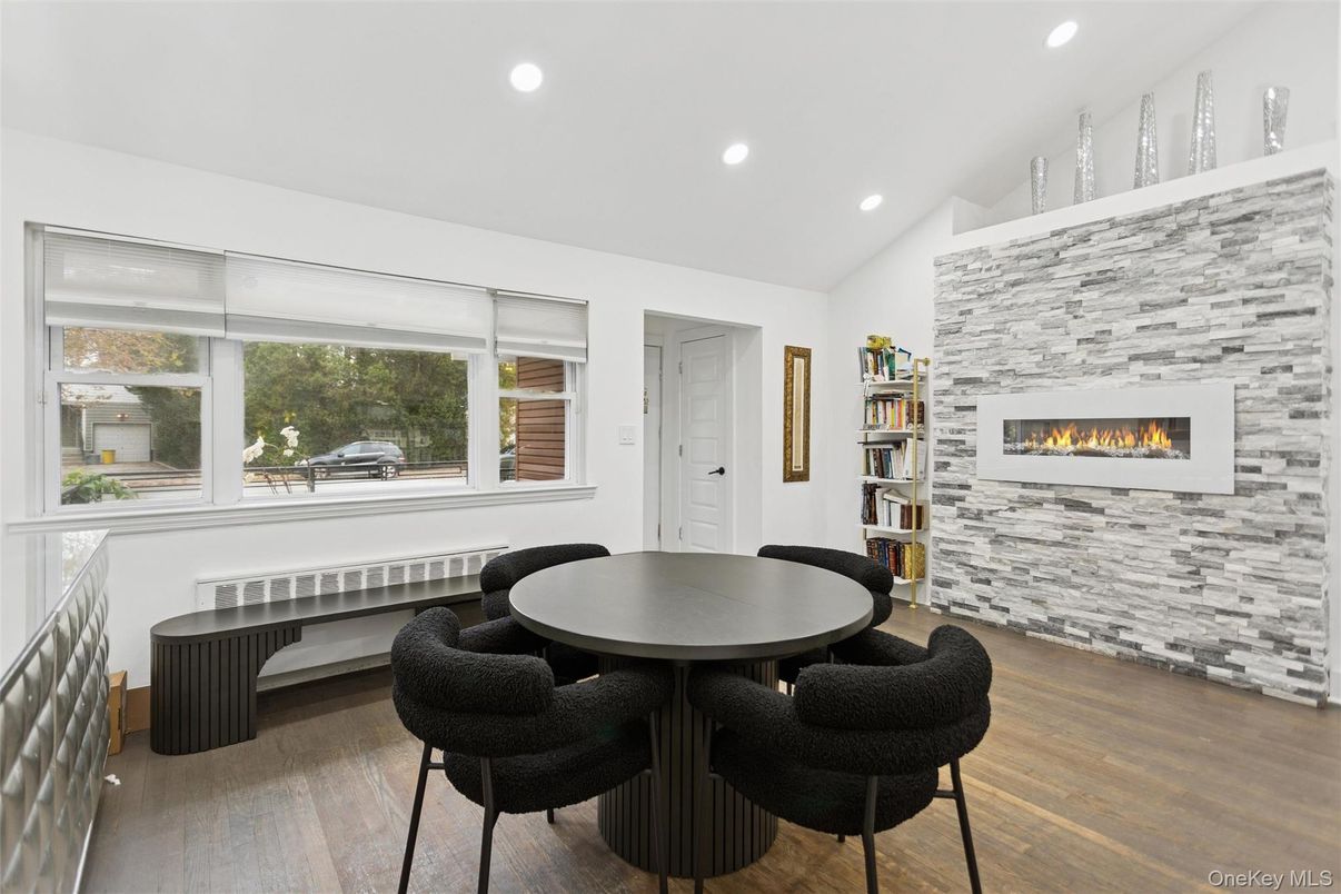 Dining room, Fireplace, Interior, Recessed Lighting, Stone Walls, Wood Texture Flooring