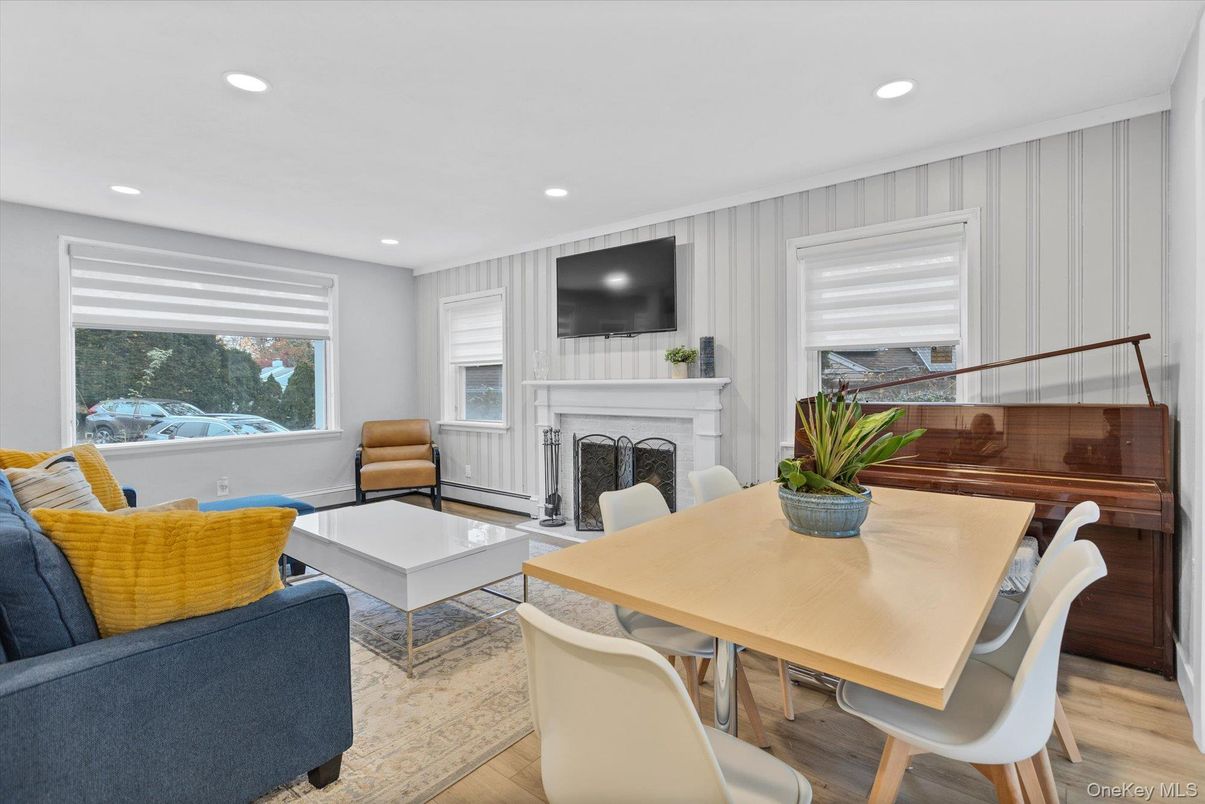 Dining room, Fireplace, Interior, Living room, Recessed Lighting, Wood Texture Flooring