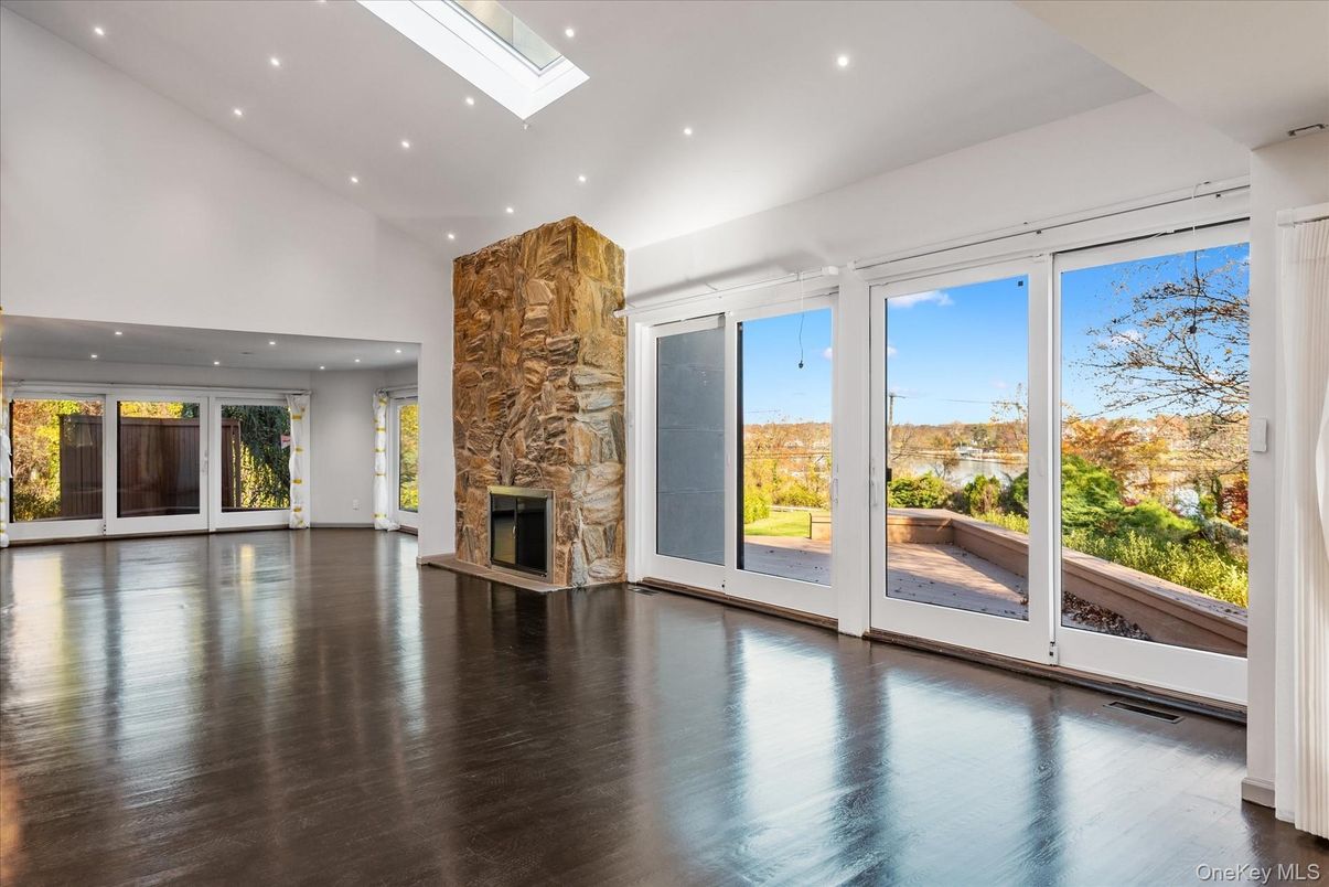Empty room, Fireplace, Interior, Recessed Lighting, Stone Walls, Wood Texture Flooring