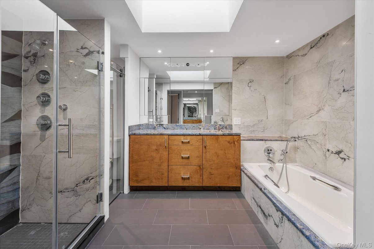Bathroom, Dual Sink Vanities, Glass Shower, Interior, Marble Walls, Recessed Lighting