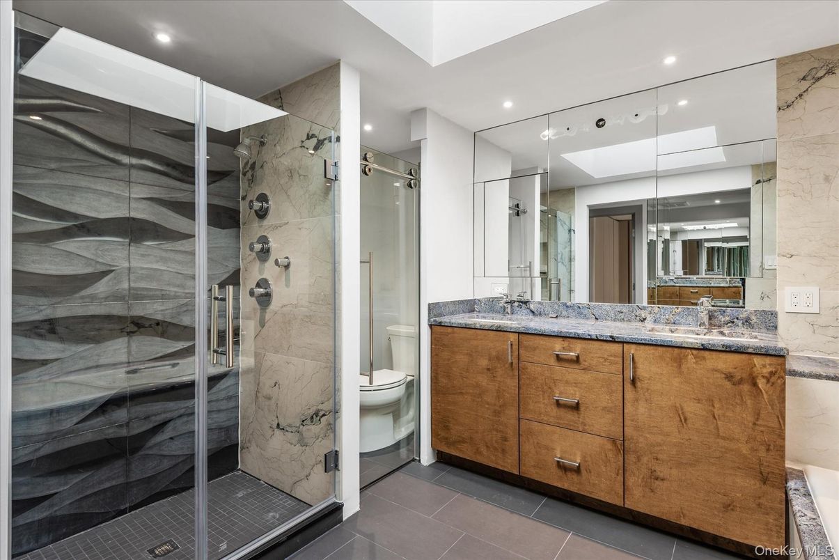 Bathroom, Dual Sink Vanities, Glass Shower, Interior, Marble Walls, Recessed Lighting