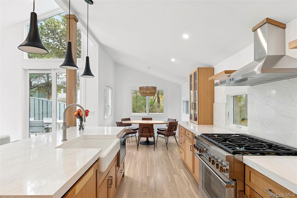 Dining room, Interior, Kitchen, Pendant Lights, Recessed Lighting, Stainless Steel Appliances, Wood Texture Flooring