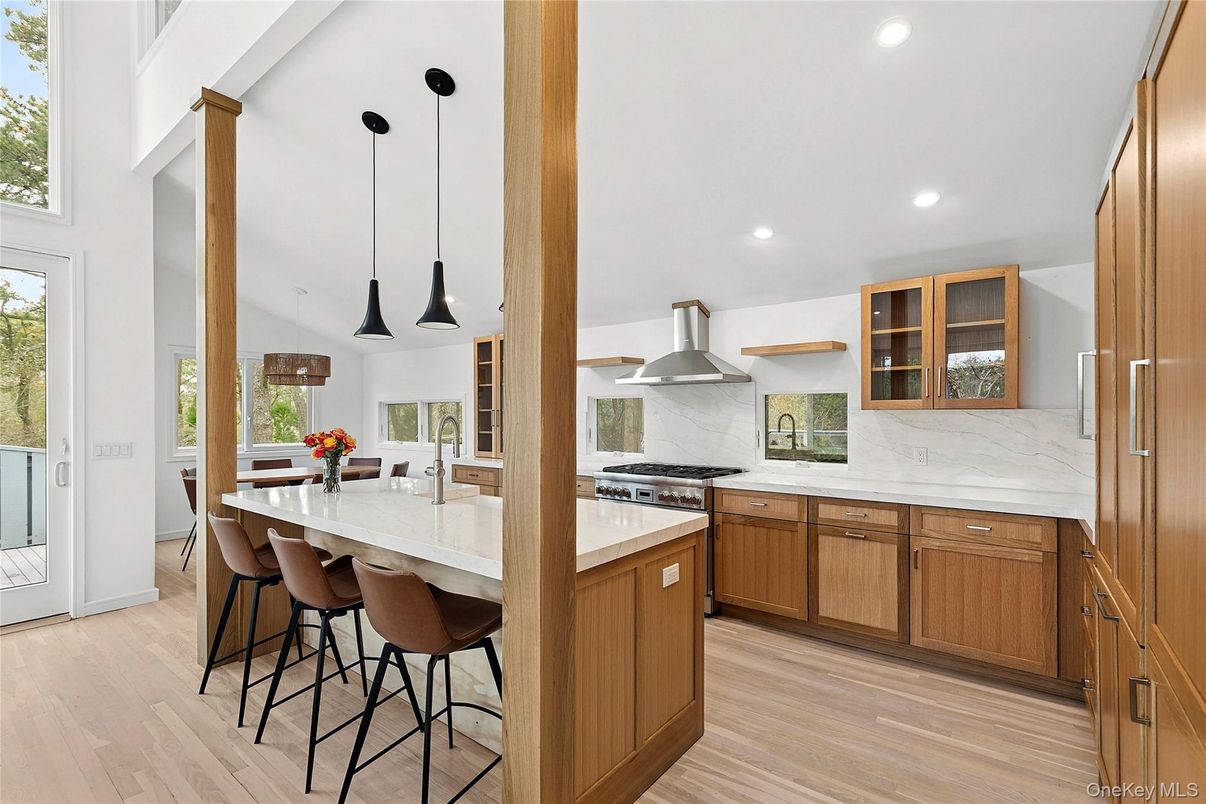 Interior, Kitchen, Marble Walls, Pendant Lights, Recessed Lighting, Stainless Steel Appliances, Wood Texture Flooring