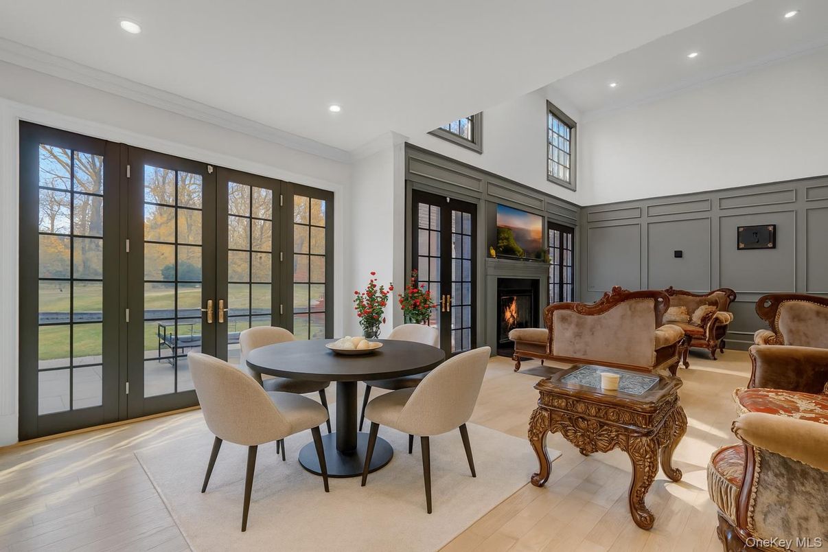 Dining room, Fireplace, Interior, Living room, Recessed Lighting, Wood Texture Flooring