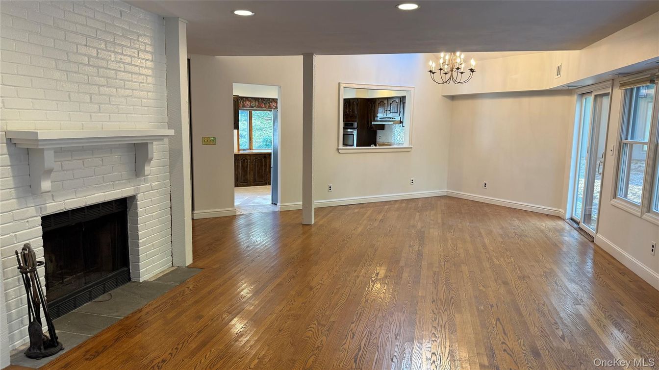 Chandelier, Empty room, Fireplace, Interior, Recessed Lighting, Wood Texture Flooring