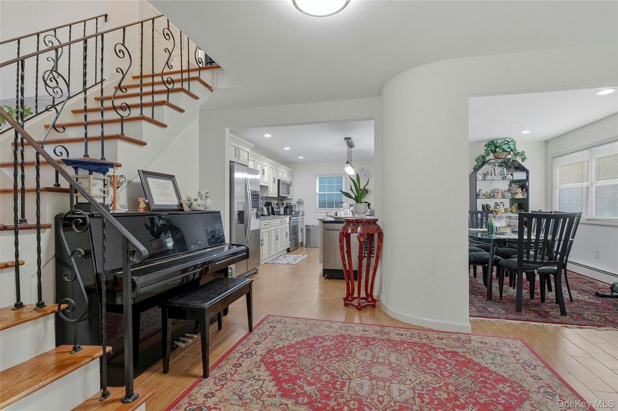 Dining room, Interior, Kitchen, Piano, Recessed Lighting, Stainless Steel Appliances, Wood Texture Flooring