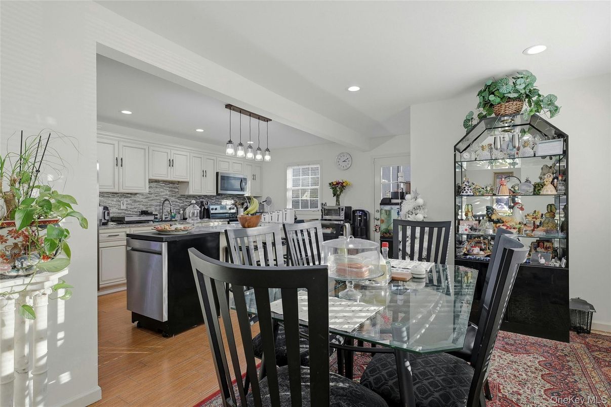 Dining room, Interior, Kitchen, Pendant Lights, Recessed Lighting, Stainless Steel Appliances, Wood Texture Flooring