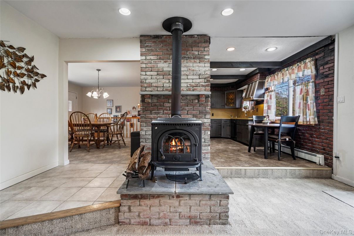 Dining room, Fireplace, Interior, Pendant Lights, Recessed Lighting, Stone Walls